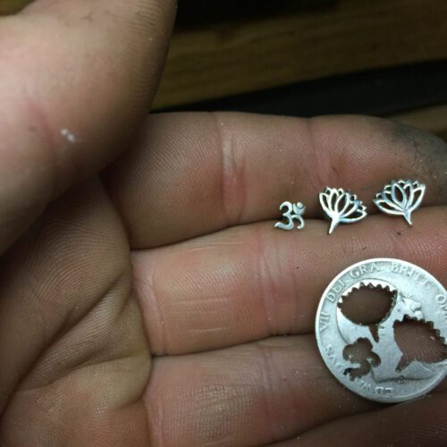 rebirth and regeneration louts flower and om earrings handmade and recycled silver coin