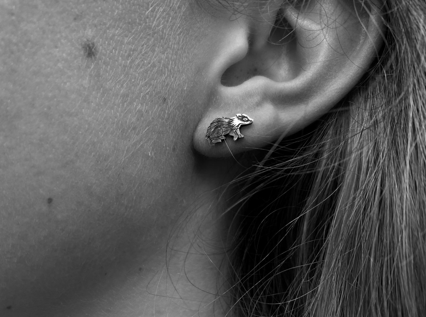Badger and moon earrings made from recycled silver shillings