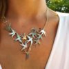 Swallows necklace handcrafted and recycled from a 100 year old silver Shilling coins.