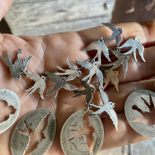 Swallows necklace handcrafted and recycled from a 100 year old silver Shilling coins.