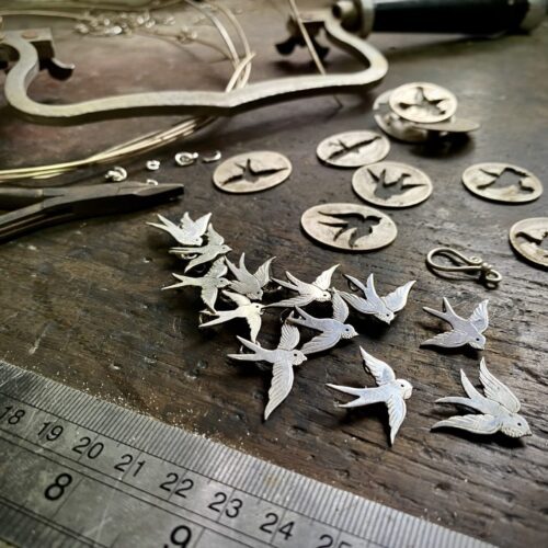 Swallows necklace handcrafted and recycled from a 100 year old silver Shilling coins.