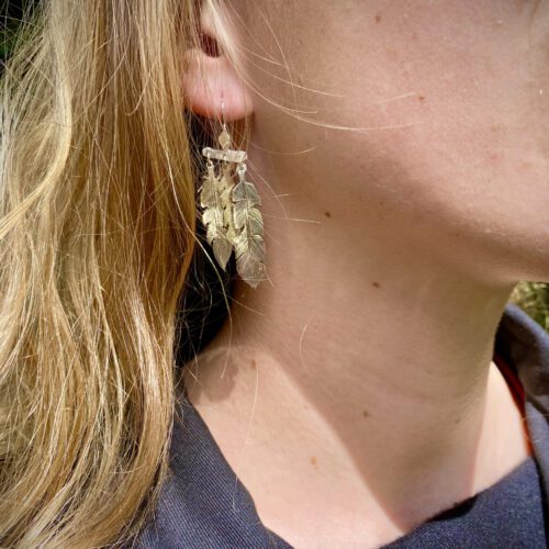 dream seeker feather earrings made from silver coins