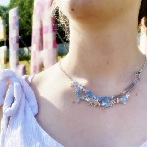 wolves wolf pack necklace handcrafted and recycled from silver shilling coins. Made in Cambridge, England
