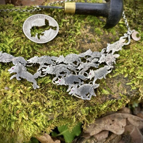 handmade ethical wolf pack silver wolves necklace made from silver coins in England. Each one is completely original