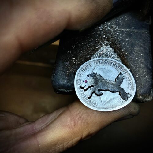 handmade ethical wolf pack silver wolves necklace made from silver coins in England. Each one is completely original