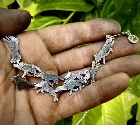 wolf pack necklace handcrafted and recycled from silver shilling coins. Made in Cambridge, England