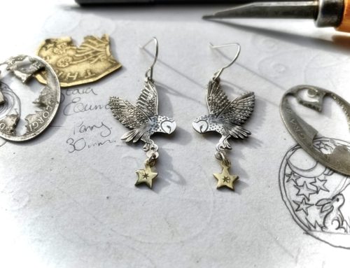 handcrafted and ethical silver flying barn owl earrings pouncing on a star recycled from silver coins