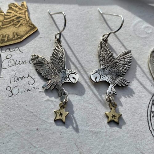 handcrafted and ethical silver flying barn owl earrings pouncing on a star recycled from silver coins