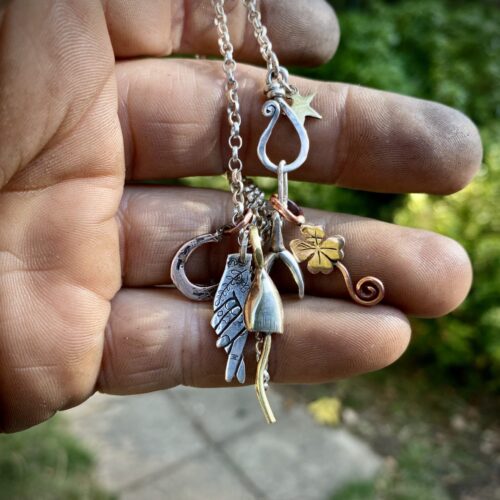fingers crossed lucky symbol imploring Gods intervention early Christian cross and fish symbol necklace ethically made in England