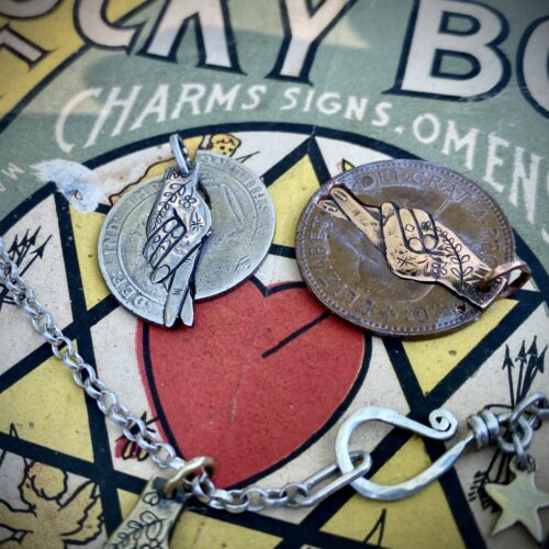 fingers crossed lucky symbol imploring Gods intervention early Christian cross and fish symbol necklace ethically made in England