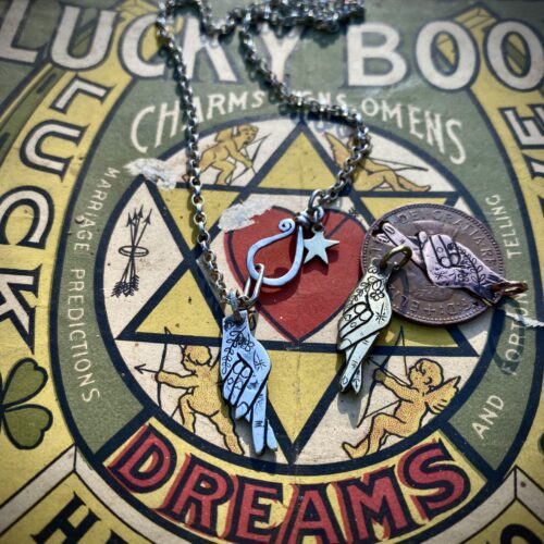 fingers crossed lucky symbol imploring Gods intervention early Christian cross and fish symbol necklace ethically made in England
