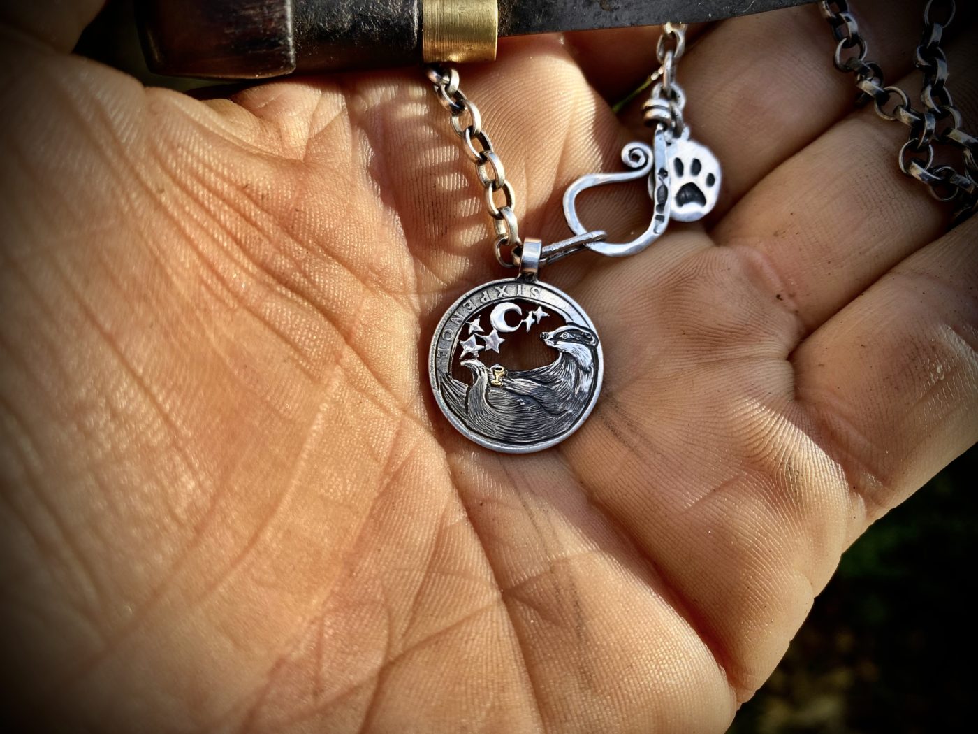 Handcrafted and recycled silver sixpence trufflehunter badger necklace totally handcrafted and recycled from old sterling silver shilling coins. Designed and created by Hairy Growler Jewellery, Cambridge, UK. necklace