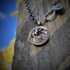 Handcrafted and recycled silver sixpence bklackbirdr necklace totally handcrafted and recycled from old sterling silver sixpence coins. Designed and created by Hairy Growler Jewellery, Cambridge, UK. necklace