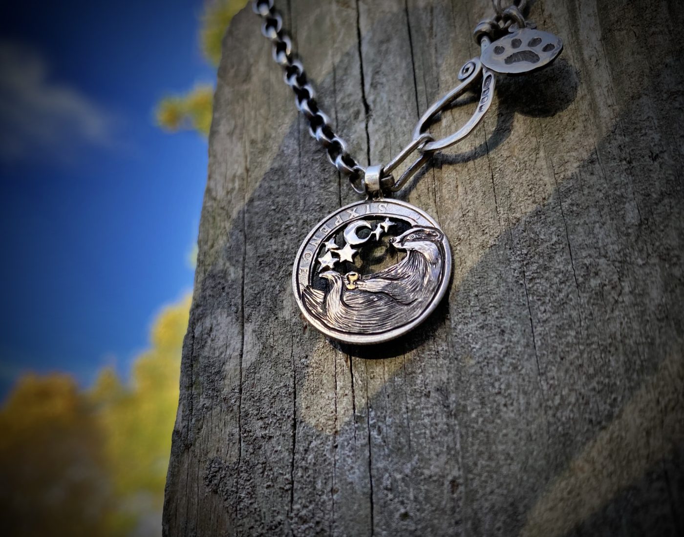 Handcrafted and recycled silver sixpence bklackbirdr necklace totally handcrafted and recycled from old sterling silver sixpence coins. Designed and created by Hairy Growler Jewellery, Cambridge, UK. necklace