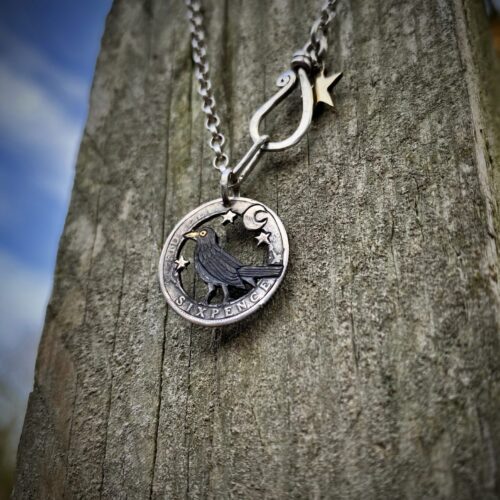 sing a song of sixpence blackbird jewellery. Handcrafted and recycled silver sixpence bklackbirdr necklace totally handcrafted and recycled from old sterling silver sixpence coins. Designed and created by Hairy Growler Jewellery, Cambridge, UK. necklace