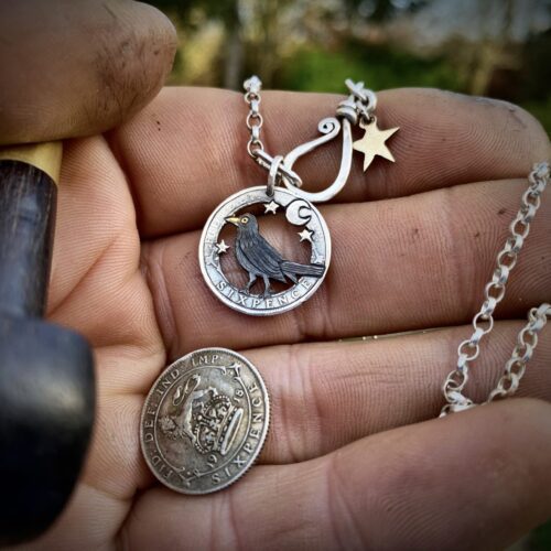 sing a song of sixpence blackbird jewellery. Handcrafted and recycled silver sixpence bklackbirdr necklace totally handcrafted and recycled from old sterling silver sixpence coins. Designed and created by Hairy Growler Jewellery, Cambridge, UK. necklace