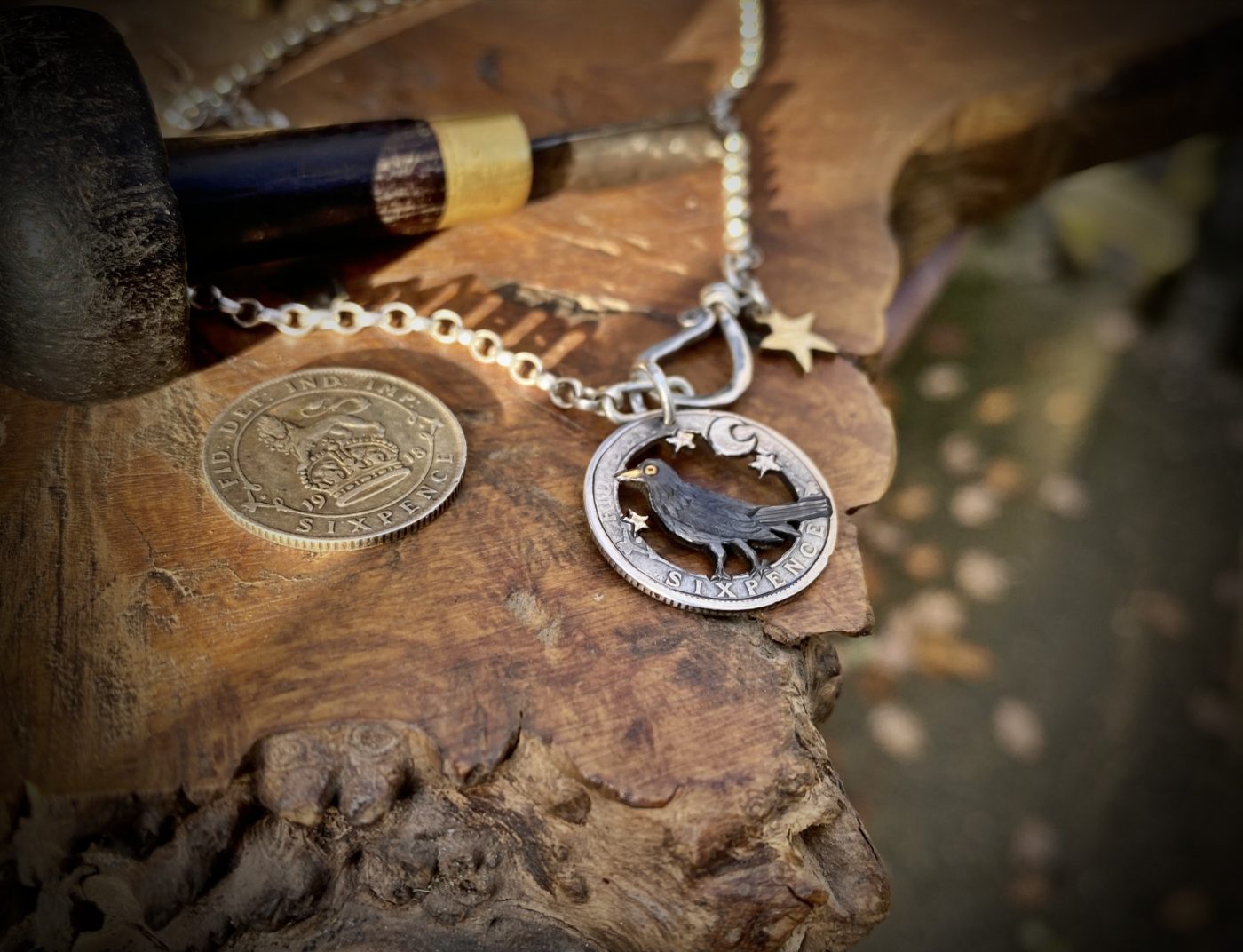 sing a song of sixpence blackbird jewellery. Handcrafted and recycled silver sixpence bklackbirdr necklace totally handcrafted and recycled from old sterling silver sixpence coins. Designed and created by Hairy Growler Jewellery, Cambridge, UK. necklace