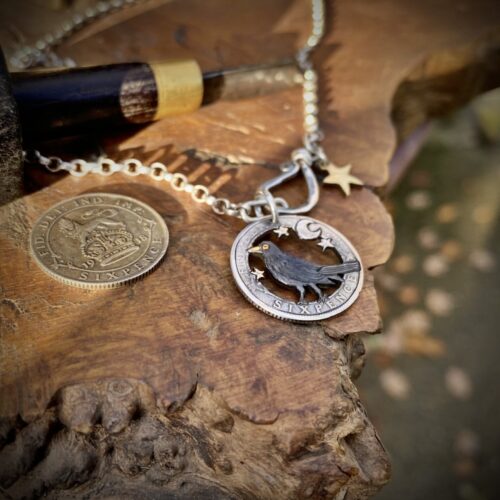 sing a song of sixpence blackbird jewellery. Handcrafted and recycled silver sixpence bklackbirdr necklace totally handcrafted and recycled from old sterling silver sixpence coins. Designed and created by Hairy Growler Jewellery, Cambridge, UK. necklace