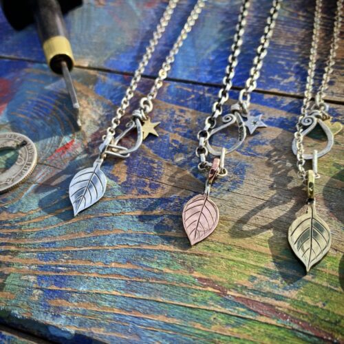 Apple tree leaves necklace ethical jewellery made from recycled silver coins.
