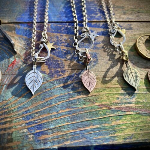 Apple tree leaves necklace ethical jewellery made from recycled silver coins.
