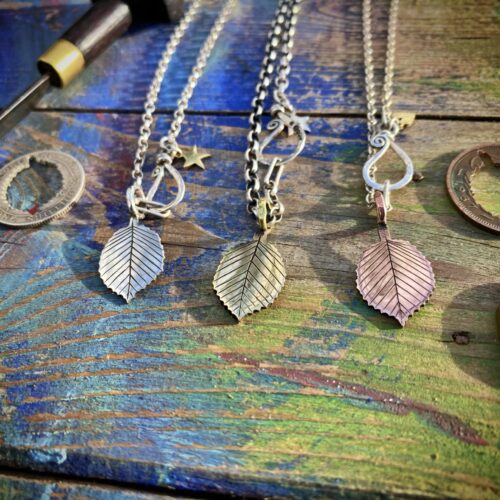Hazel tree leaves necklace ethical jewellery made from recycled silver coins.