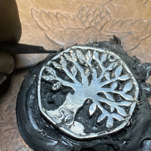 Hand cut coin jewellery - Recycled old Fifty pence coins