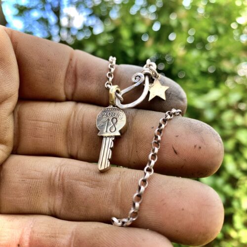 18th birthday gift idea handmade and ethically recycled key necklace pendant made in England from a upcycled pound coin 2005