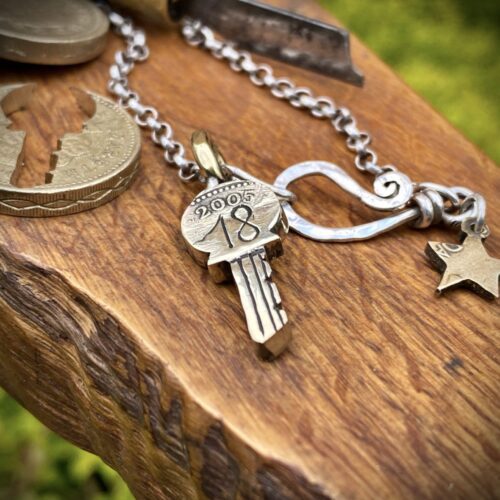 18th birthday gift idea handmade and ethically recycled key necklace pendant made in England from a upcycled pound coin 2005