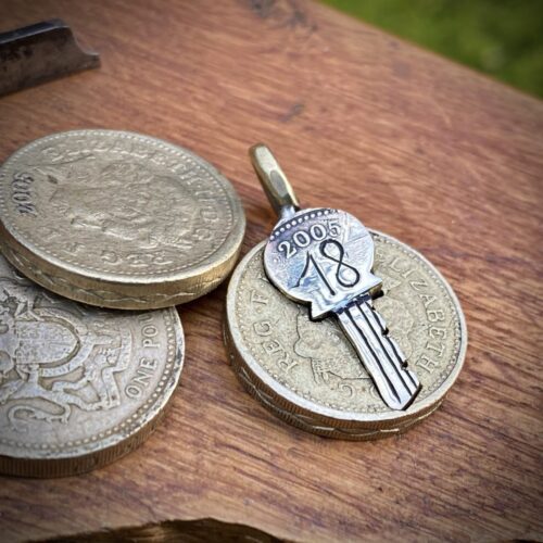 18th birthday gift idea handmade and ethically recycled key necklace pendant made in England from a upcycled pound coin 2005