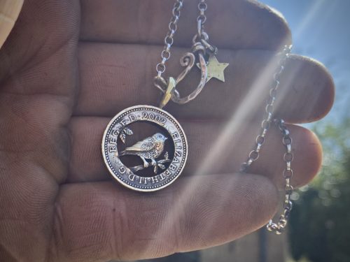 21st birthday gift idea handmade and ethically recycled free as a bird necklace pendant made in England from a upcycled pound coin 2002