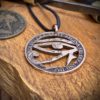 Handcrafted and repurposed coin eye of horus pendant necklace
