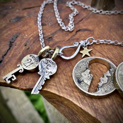 21st birthday gift idea handmade and ethically recycled key necklace pendant made in England from a upcycled pound coin 2002