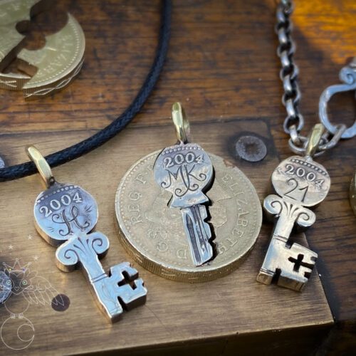 21st birthday gift idea handmade and ethically recycled key necklace pendant made in England from a upcycled pound coin 2004