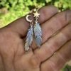 handmade and original silver feather earrings made with ethical considerations and materials