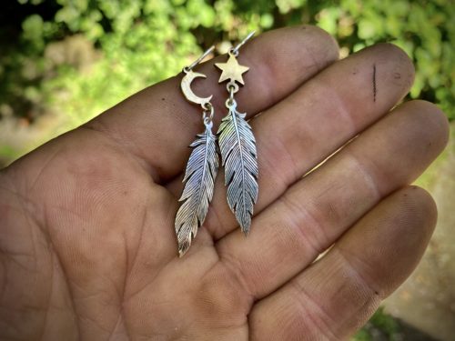 handmade and original silver feather earrings made with ethical considerations and materials