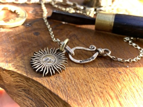 sun and moon jewellery made from old coins unique to hairy growler