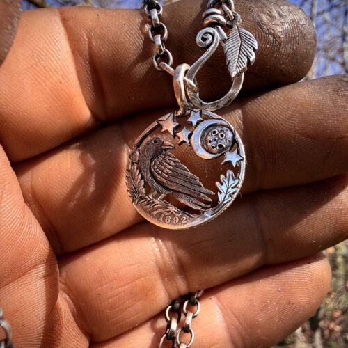 Raven jewellery. Handcrafted and recycled silver sixpence raven necklace totally handcrafted and recycled from old sterling silver sixpence coins. Designed and created by Hairy Growler Jewellery, Cambridge, UK. necklace
