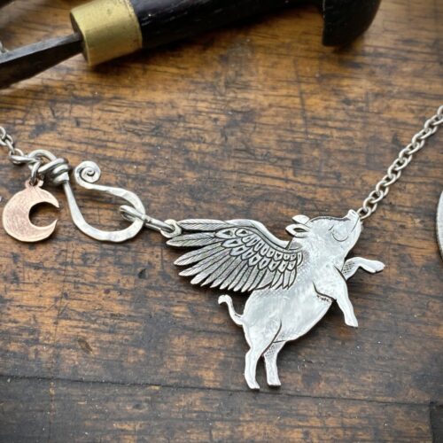 Handcrafted and recycled sterling silver flying-pig necklace