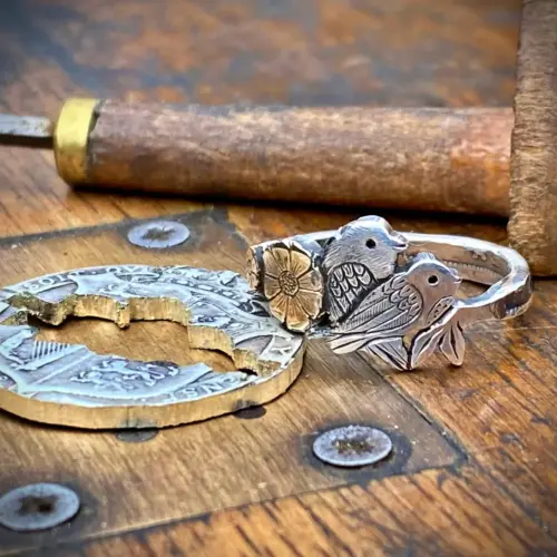 Birdsong ring meticulously hand crafted from a silver half crown coin using traditional hand tools