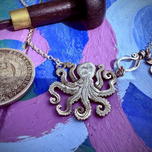 Handmade and upcycled, recycled silver coin kraken octopus necklace made in landlocked Cambridge, UK
