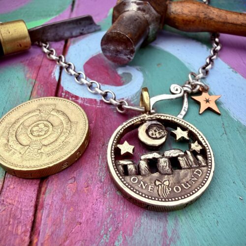 Stonehenge under moon recycled pound coin
