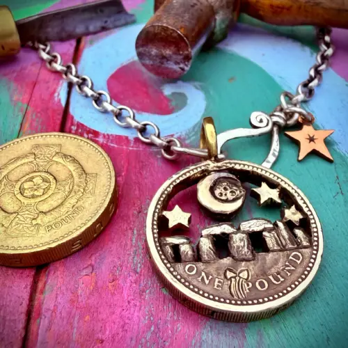 Stonehenge under moon recycled pound coin