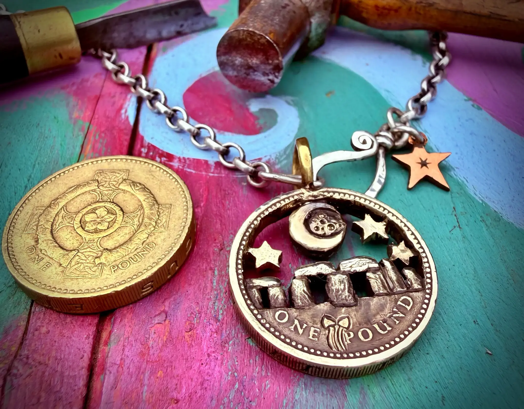 Stonehenge under moon recycled pound coin