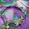 Wolf bracelet made from recycled silver shillings. A pack of wolves racing around your wrist.