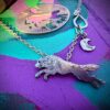 hungry like the wold necklace made from sterling silver recycled from and old silver coin and a lovely ruby eye