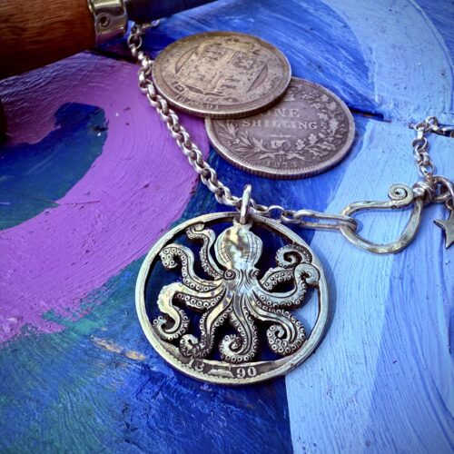Handmade and upcycled, recycled silver coin kraken octopus necklace made in landlocked Cambridge, UK