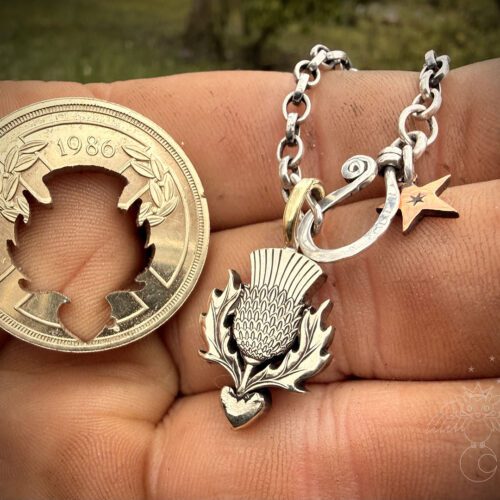 Thistle necklace pendant handmade from an old coin