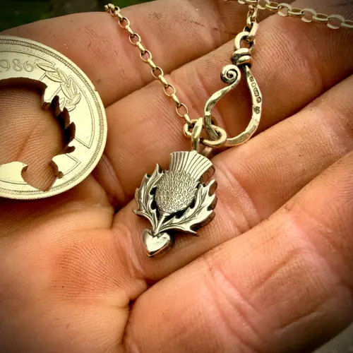 Thistle necklace pendant handmade from an old coin