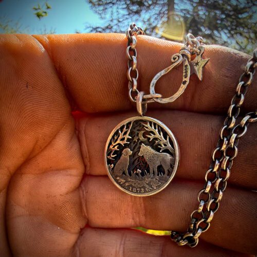 the dimpsey time. A dimply necklace pendant made from upcucled silver shilling coins in Cambridge England