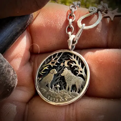 the dimpsey time. A dimply necklace pendant made from upcucled silver shilling coins in Cambridge England